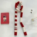 Detail view of a red and white striped knitted scarf with a small label, soft winter accessory. - Red White Color Block (24101007) / Red / 180*12cm