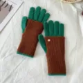 Detailed close-up of color-block knit gloves in green and brown, cozy winter warm texture. - One Size / Finger Style / Brown Green