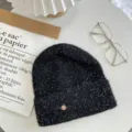Chic winter black knit beanie with silver glitter, stylish metal charm and trendy flat lay details. - One Size / Black