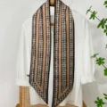 Detailed view of long narrow silk scarf with houndstooth and khaki stripe pattern. - Small Floral Print - 5