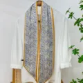 Detailed view of the elegant floral skinny scarf with gold border, perfect for bag or hair styling. - Small Floral-3