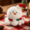 Cute Christmas plush toy wearing a knit santa hat and festive scarf for holiday decor. - Snowman