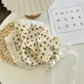 Detailed shot of beige lace triangle hair scarf with cute bow pattern and delicate ties. - Triangle Scarf-8