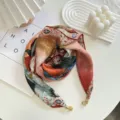 Detail view of stylish lightweight floral scarf with elegant magnetic buckle closure for spring. - Scarf-10