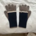 Detail of color-blocked knit gloves featuring warm long cuffs and touchscreen compatible fingers. - One Size / Khaki