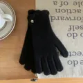 Women black knitted gloves winter warm wool gloves with ruffles and metal button decoration. - 23cm x 8cm / Black