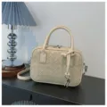 Beige woven leather shoulder bag with top handle and knot detail for women fashion daily use. - Beige