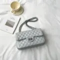 Chic quilted chain shoulder bag for women, stylish commuting crossbody bag with metal lock. - Sky Blue