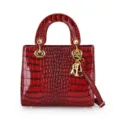 Elegant red patent crocodile embossed top handle shoulder crossbody handbag with gold hardware. - Red