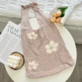 Knitted floral tote bag detail showing the soft hollow-out knit texture and cute white flower pattern. - Apricot