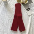 Detail view of red knitted half-finger sleeves, cozy ribbed winter arm warmers with patch label. - One Size / Red (XTB00174)