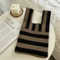 Knit handbag detail, brown and black striped tote bag displayed on a modern white table. - One Size (20cmX35cm) / Black and Coffee Stripe