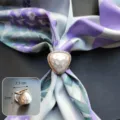 Detailed view of the elegant triangular pearl scarf ring featuring sparkling rhinestone pavé. - Triangle Shell / Gold