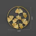 Gold metal ginkgo leaf wall hanging, round Nordic decor piece for living room home. - Golden Ginkgo Leaf Circle