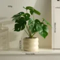 Artificial monstera plant potted in a white ceramic vase for indoor office desk decor - Round Pot 12-Head Monstera Leaf Set with Pot