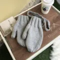 Grey thick knit winter mittens with hanging string, cozy wool gloves for cold weather detail view. - One Size / Gray