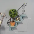 Wall mounted staircase iron wood shelf with hooks and small plant pots for home decor. - Blue