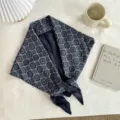 Detailed close-up view showing the retro botanical pattern texture of the dark blue triangular scarf. - 140*70cm / Blue Plaid