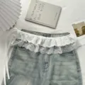 White lace denim skirt extender detail showcasing layered ruffles and cute side tie bows. - One Size / White