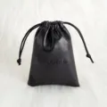 Schwarzer PU-Leder Schmuckbeutel mit Kordelzug zur sicheren Aufbewahrung kleiner Accessoires. - 7x9cm / Schwarz