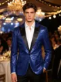 Close-up of royal blue sequin blazer detail, black lapel, elegant stage party menswear. - Blue