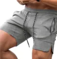 Men grey athletic gym shorts with zipper pockets and adjustable drawstring casual apparel - Light Gray