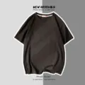 T-shirt basique ample et décontracté à manches courtes uni unisexe pour le style de rue d'été - S / Hauts / Noir