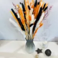 Detailed view of colorful dried rabbit tail grass bouquet in a modern gray glass vase on table. - Gold SP004