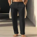 Detailed view of men's black straight-leg casual trousers with slanted pockets and breathable fabric. - S / Black