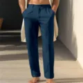 Closeup detail of casual deep blue straight-leg linen trousers featuring side pockets. - Navy Blue