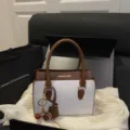 Two-tone top handle handbag for women, vintage color-block shoulder bag with cute cherry charm. - White