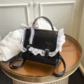 Black PU leather small backpack for women, featuring cute lace trim and bow knot design. - Black With Pendant