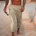 Dettaglio pantaloni spiaggia uomo lino leggero cordoncino estate orlo risvolto - Kaki