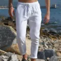 Men's white linen casual beach pants, loose fit summer drawstring trousers for outdoor wear. - S / White