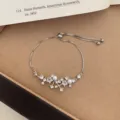 Minimalist silver slider bracelet featuring sparkling pearls and cute cubic zirconia stars. - TSW46 Star Rhinestone Cluster Bracelet