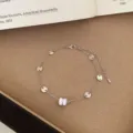 Minimalist silver bracelet with round discs and white bead charm for everyday chic style. - TSW54 Silver Cylindrical Bead Bracelet