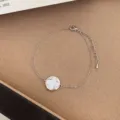 Minimalist silver-tone bracelet featuring a classic white clover pendant for daily elegant wear. - TSW11 Clover Bracelet