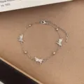 Silver butterfly charm bracelet with sparkling zirconia stones and delicate thin chain jewelry - TSW22 Multi-Butterfly Bracelet