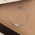 Silver adjustable bracelet with crystal CD charm, versatile delicate daily jewelry for women. - TSW23 Pave Rhinestone Interlocking Loop Bracelet