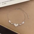 Silver tone multi heart charm bracelet with adjustable extension chain for women and girls daily wear. - TSW50 Silver Heart Bracelet