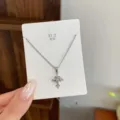 Silver cross zirconia necklace with fine chain, elegant minimalist daily commuter jewelry style. - TXL101 Hollow Heart Rhinestone Cross Necklace