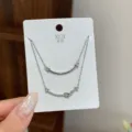 Double layer silver smile necklace with delicate micro set rhinestones pendant on white card. - TXL110 Smile Double Layer Necklace