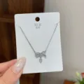 Silver bowknot pendant necklace with sparkling cubic zirconia, elegant and delicate daily jewelry. - TXL127 Bowknot Heart Necklace