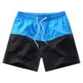 Short de bain homme bicolore décontracté pour l'été avec taille élastique et cordon. - Bleu clair
