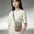 Solid color canvas cross-body mobile phone bag with adjustable strap and small front tag. - Beige Gray - 3-Layer Canvas