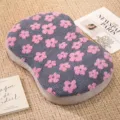 Cozy grey memory foam pillow with pink fluffy flower plush design, soft and comfortable. - Deep purple