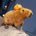 Cute capybara plush toy with pumpkin hat, soft stuffed animal doll for kids and home decor. - 30cm / Brown