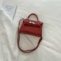 Red retro trapezoid shoulder bag with metal lock detail and top handle variant. - No Pendant / Red