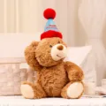 Lindo peluche de oso de peluche marrón con sombrero de cumpleaños azul y rojo para fiestas. - 26cm / Oso de cumpleaños