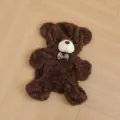 Brown plush teddy bear skin shell, soft furry material with a cute plaid bow tie, detail view. - Dark Brown Skin Shell